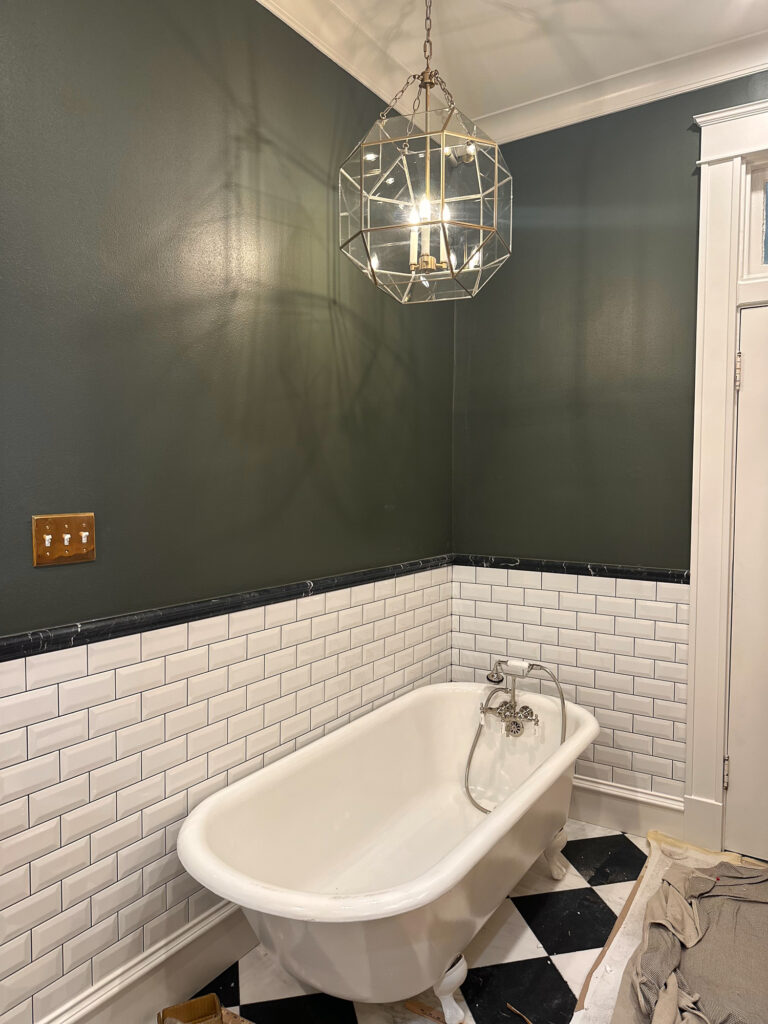 Visual Comfort Morrison Pendant in Gold in a bathroom